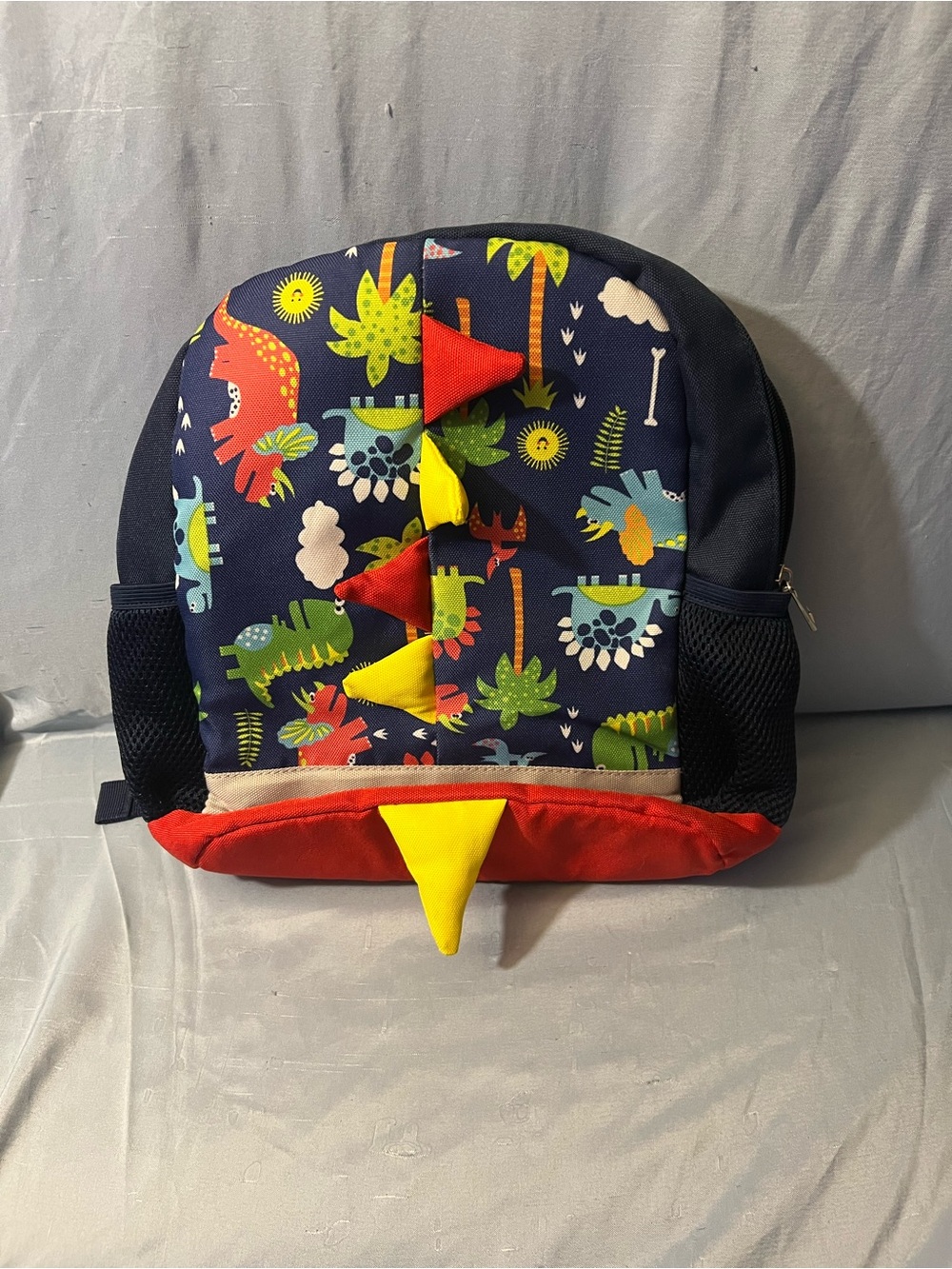 Kids Dinosaur Print Navy Backpack with Red & Yellow Accents